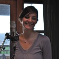 Laura smiling away from the microphone. - © 2010 Sam Carroll